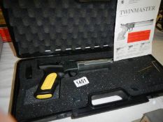 A cased Twinmaster 177 target air pistol.