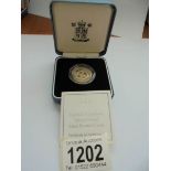 A cased 2000 silver proof £1 Northern Ireland coin with certificate.