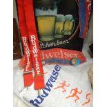 A Budweiser sign and shirt.