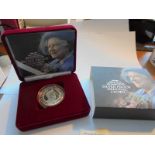 A cased 'The Queen Mother' 1900-2002 silver proof memorial crown with certificate.