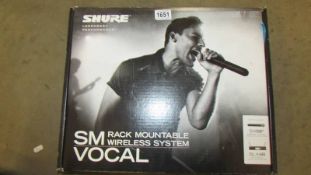 A boxes Shore BLX4R rack mountable wireless microphone system.