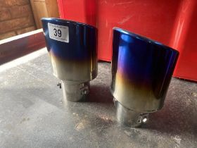 2 Titanium effect car exhaust tail pipe trims, to fit approximately 1.5"/2" pipe. Collect Only.
