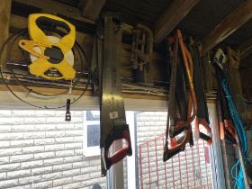 A selection of saws and a 30 m Stanley tape. Collect Only.