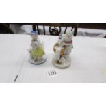 Two 19th century continental porcelain figures with crosses sword mark.