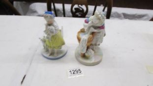 Two 19th century continental porcelain figures with crosses sword mark.