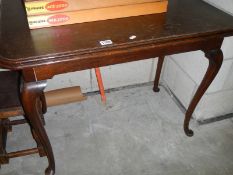 An Edwardian oak fold over tea/card table on Queen Anne legs, COLLECT ONLY.