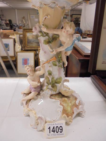 A continental porcelain cherub decorated table centrepiece. - Image 2 of 3
