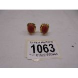 A pair of yellow gold earrings set coral (test as 18ct), total weight 6.6 grams.