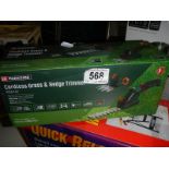 A boxed Parkside grass and hedge cutter.