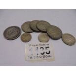 Eight India silver coins, approximately 69 grams.