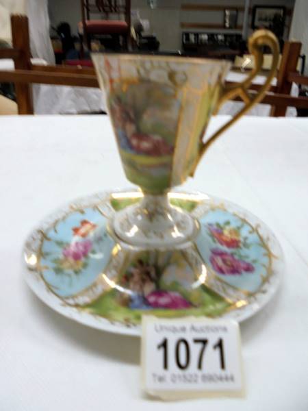 A hand painted Austrian tea cup and saucer.