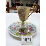 A hand painted Austrian tea cup and saucer.