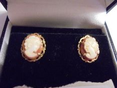 A pair of 9ct gold cameo set stud earrings.