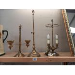 A brass table lamp, candle lamp and one other.