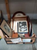 A quantity of frames containing old family photographs.