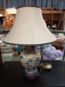 A blue and white oriental ginger jar with gilding detail table lamp.