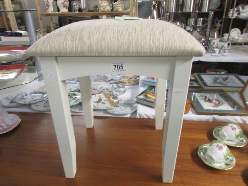 A painted foot stool.