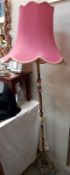 A vintage onyx and brass floor standing standard lamp.