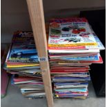 A large quantity of model collector magazines.