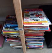 A large quantity of model collector magazines.