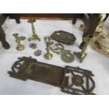 A mixed lot of horse brasses, candlesticks etc.,