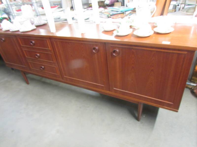 A good teak sideboard. Approximately (84" x 17.5" x 30.5" high) COLLECT ONLY.