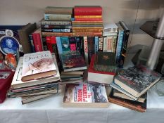 A selection of books, various titles.