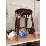 A bamboo and wicker plant stand, height 53cm, diameter 38cm. Collect Only.