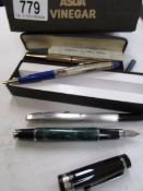 A quantity of pens including fountain pens.