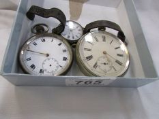 A silver cased wrist watch and two metal cased pocket watches, all a/f.