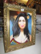 A framed oil on canvas painting of Amy Winehouse signed E Cunnington.