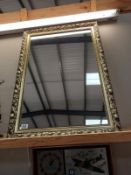 A gilt framed mirror. 61cm x 86cm.