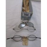 Three pairs of vintage spectacles.