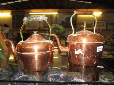 Two copper kettles.