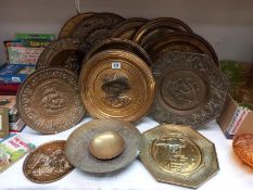 A quantity of brassware, mostly wall plaques.