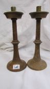 A pair of wooden candle sticks.