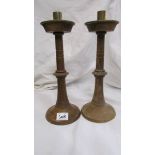 A pair of wooden candle sticks.