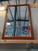 A pine framed mirror.