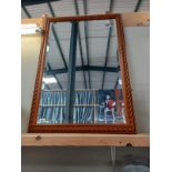 A pine framed mirror.