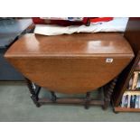 A 1930's oak galley table with barley twist legs. Closed 91cm x 40cm x height 74cm, Open 91cm x