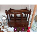 An oak mid 20th century magazine rack with single drawer.