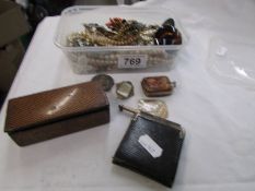 A mixed lot of costume jewellery, silver pencil. silver rimmed notepad, miniature purse etc.,