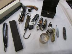 A tray of vintage pocket knives, cork screws, small brass spirit level etc.,