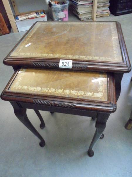 A nest of two tables with glass tops. COLLECT ONLY.