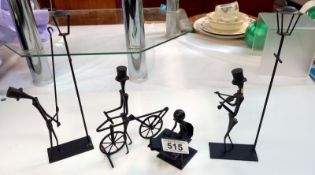 4 Iron handmade figures including lamp lighter, violinist etc.