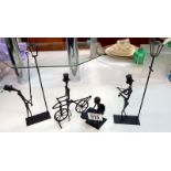 4 Iron handmade figures including lamp lighter, violinist etc.