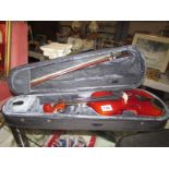A Stagg violin in soft case. Length 28cm.