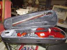 A Stagg violin in soft case. Length 28cm.