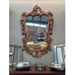 A gilt ormolu framed mirror 57cm x 91cm. Collect Only.