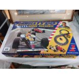 A boxed Formula Tyco Nigel Mansell racing set